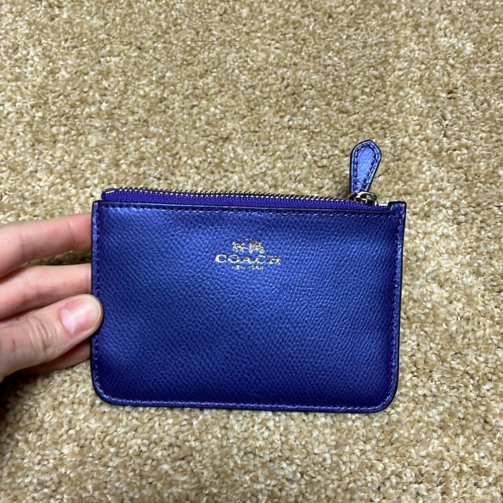 NWT Coach zip wallet. Beautiful reflective purple-blue color.